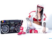 Extravagant bad girl Christy Mack poses in sexy Hip-Hop style clothing