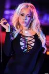 Attractive blonde Luna Star stripping out off her black dress showing her body