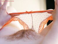 Busty redhead Chloe B plays with large natural tits and licks own nipple