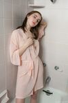Cute young teen Eva Green petting her wet bald pussy in the shower