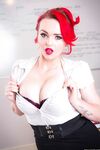 Stunning redhead teacher Jasmine James displaying her curvy body in class