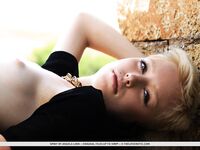 Slender teen Spirit displays her very tiny tits posing nude in an old castle
