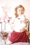 Schoolgirl Alison licks her natural tits and exposes her pink twat close up