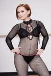 Short haired MILF Katja Kassin models sexy fishnet bodystocking
