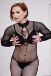 Short haired MILF Katja Kassin models sexy fishnet bodystocking