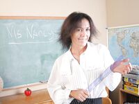 Naughty granny Nancy gets completely naked in the school room