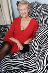 Old granny Ruth losing her red dress and exposing her saggy boobs in lingerie