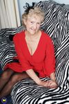 Old granny Ruth losing her red dress and exposing her saggy boobs in lingerie