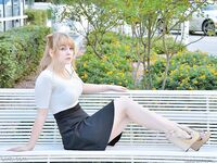 Cute young blonde flashes her big boobs and strolls naked down the street