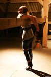 Cute blonde girl struggles against gag and ropes with her clothes still on
