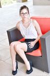 Skinny teen in glasses Shyla fists her shaved clam on an outdoor bench