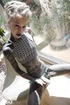 Tattooed lesbians Anuskatzz and Lily have sex with a strapon cock