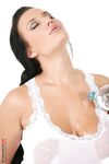 Hot brunette Carmen Croft pours water over enhanced tits and her pussy as well