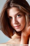 Sexy adorable Danica disrobes to crawl on the couch naked on her knees