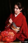 Japanese model Yuki Tsukamoto fondles her firm boobs as she gets naked