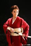 Japanese model Yuki Tsukamoto fondles her firm boobs as she gets naked
