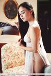 Petite Asian teen Li Moon wears revealing lingerie during solo action