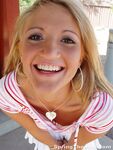Blonde teen Spring Thomas exposes her bare ass on a public sidewalk