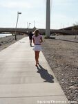 Blonde teen Spring Thomas exposes her bare ass on a public sidewalk