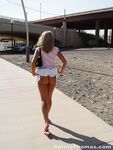 Blonde teen Spring Thomas exposes her bare ass on a public sidewalk