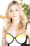 Hot blonde chick Alexa Grace works free of her tight skirt to pose nude