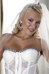 Blonde bride Katie Summers doffs her wedding dress & poses topless in lingerie