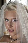 Blonde bride Katie Summers doffs her wedding dress & poses topless in lingerie