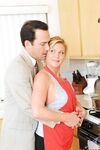 Mature lady Ginger Lynn takes a cumshot on her ass wearing tan stockings