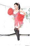 Ebony cheerleader babe poses gorgeously in her sexy red outfit