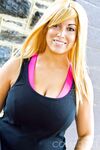 Brassy blonde fatty Tasha Cole removes shirt outside to pose in yoga pants