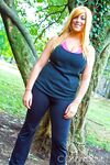 Brassy blonde fatty Tasha Cole removes shirt outside to pose in yoga pants