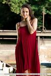 Beautiful teen Alisa Amore disrobes for nude solo poses near a dam