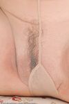 Smiley mature Jenna Covelli displays long hard nipples & pussy in pantyhose