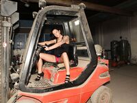 Plump tattooed German chick Kate models topless & rides cock in the garage