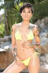 Divine chocolate Honey Gold with tattoos exposes nude body by the pond