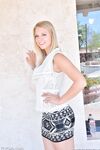 Long legged sexy blonde wearing no panties flashes naked upskirt outdoors