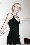 Alternative babe Symone posing for non nude pics in boots and black dress