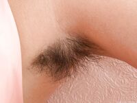 Petite teen Baby Lizza proudly exhibits hairy armpits and beaver