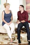 Busty MILF Ryan Conner gives an intimate massage rides her client's cock