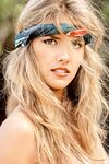 Vintage centerfold Terri Welles baring her big tits and hairy pussy outdoors