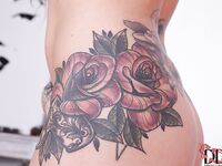 Busty tattooed hottie with pierced nipple getting rid of her clothes
