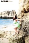 Brunette MILF Lorna Morgan releases her nice melons from bikini on a beach