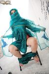 Hot Muslim babe Nadia Ali strips at a gloryhole and sucks a huge black cock
