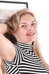 Thick amateur Ulrikke shows her tiny tits and hairy pits before parting bush