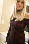 Hot teen with blonde hair poses productively while exposing upskirt thong
