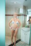 Mature blonde amateur naked in the shower lathering up her wet big tits