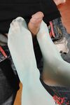Hungarian hottie Kitty Cat gets her stockings stripped before giving a footjob