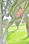 Petite blue-eyed brunette Lana strikes sexy nude poses outdoors