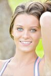 Petite blue-eyed brunette Lana strikes sexy nude poses outdoors