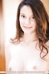 Barely legal teen Rilee Marks squats to show her shaved pussy on patio stones